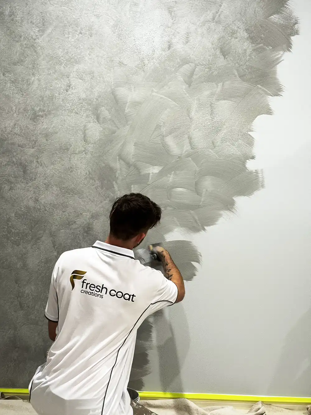 Clay painting the wall